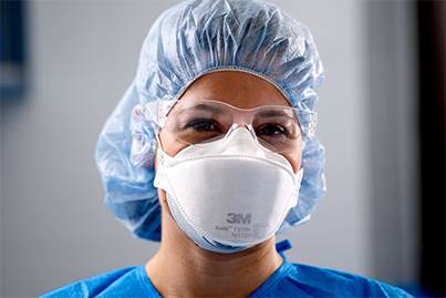 Healthcare worker wearing N95 respirator.